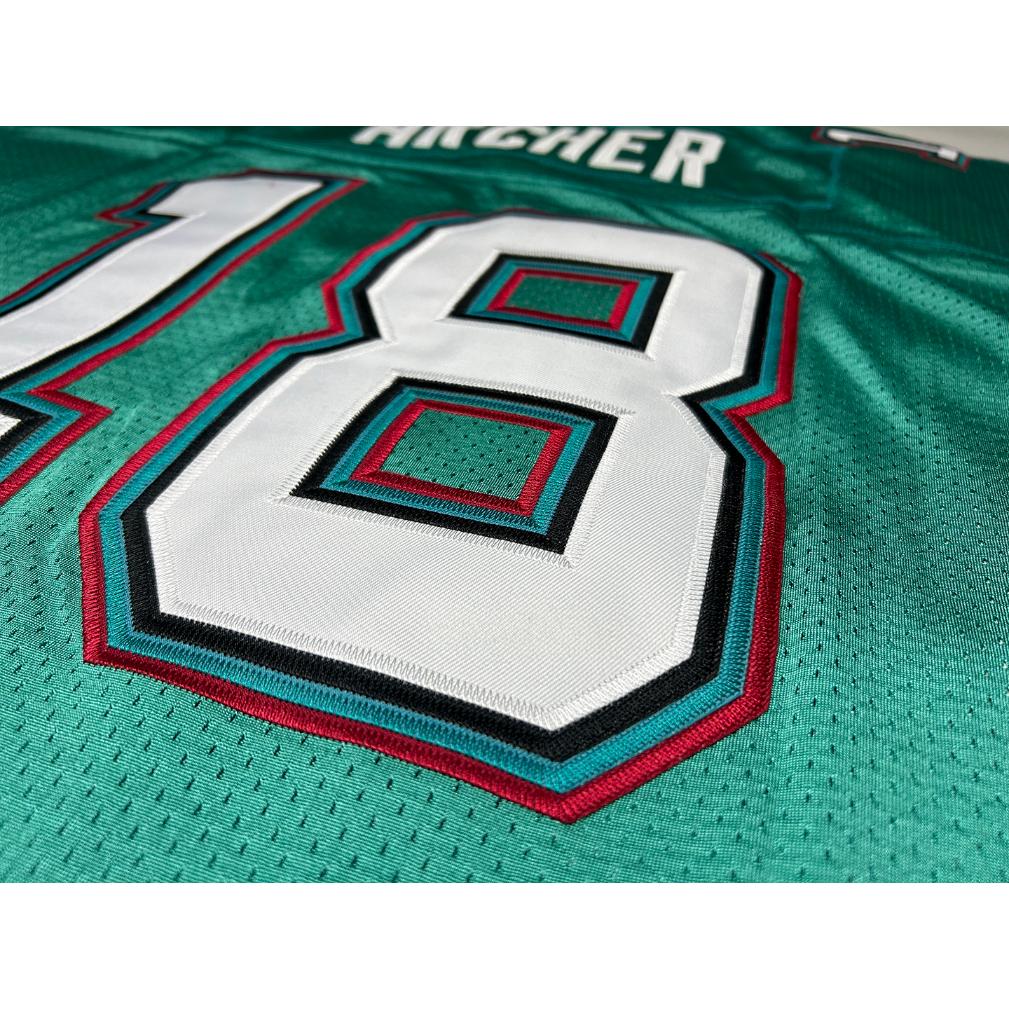 San Antonio Texans Jersey close-up teal with white numbers and lettering Royal Retros