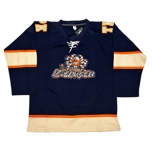 Topeka Tarantulas hockey Jersey Navy. Thin orange, thick white, thin orange bands mid-sleeve. Thin orange, thick white band at waist. Blue, orange and white spider holding hockey stick above stylized TATANTULAS in blue with orange trim and white shadow. Royal Retros
