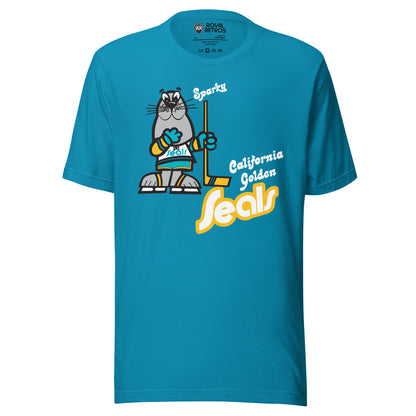 California Golden Seals Sparky T-shirt. Aqua. Gray seal on skates with gold and teal gloves holding a yellow stick. California Golden in teal small to the right of hockey stick blade. Seals below in teal with gold trim lowercase in diablo typeface. Royal Retros