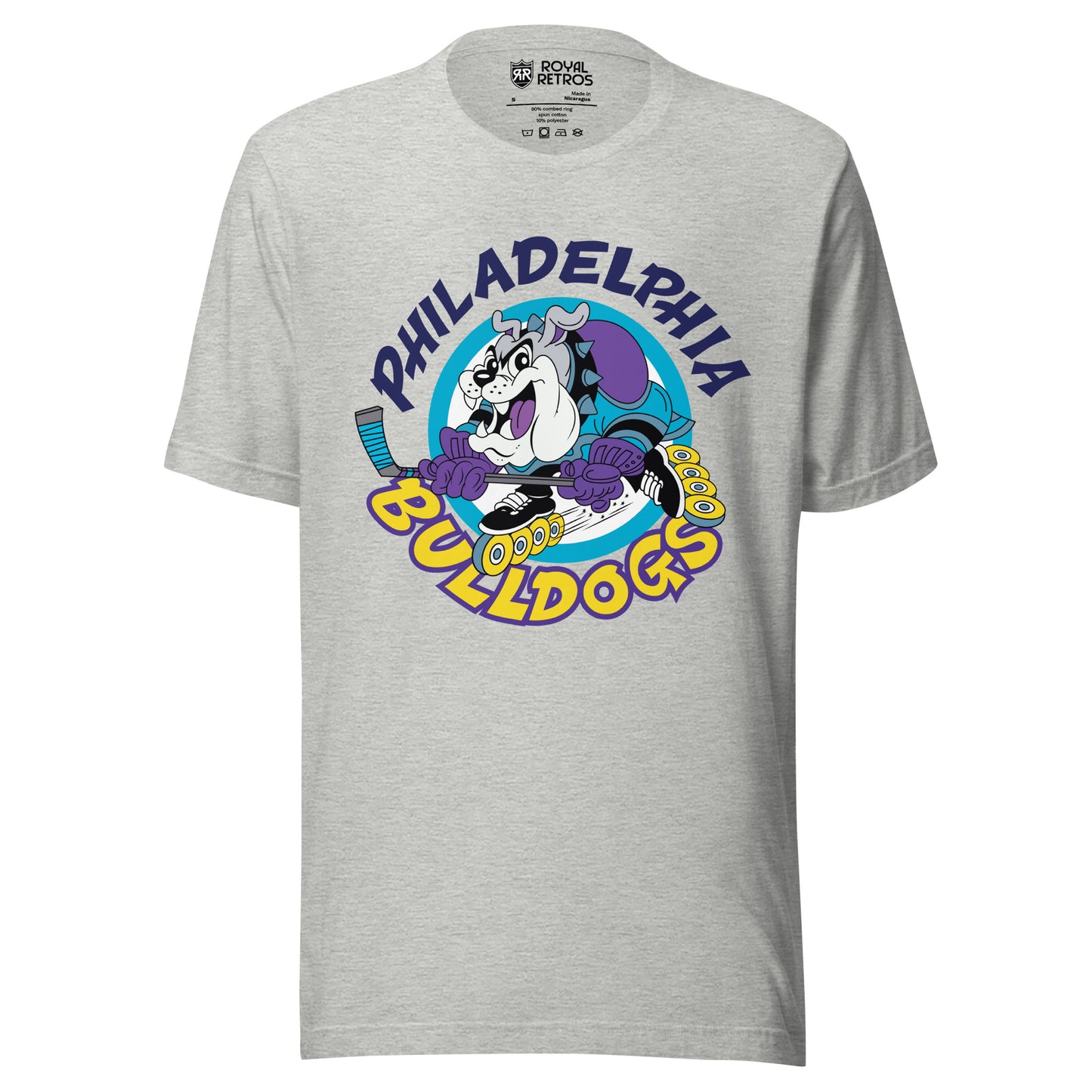 Philadelphia Bulldogs Roller Hockey -shirt. Light Grey. Philadelphia in dark purple arched over cartoon bulldog inline skating with hockey stick, going to the left. Bulldogs arched up in yellow below. Royal Retros