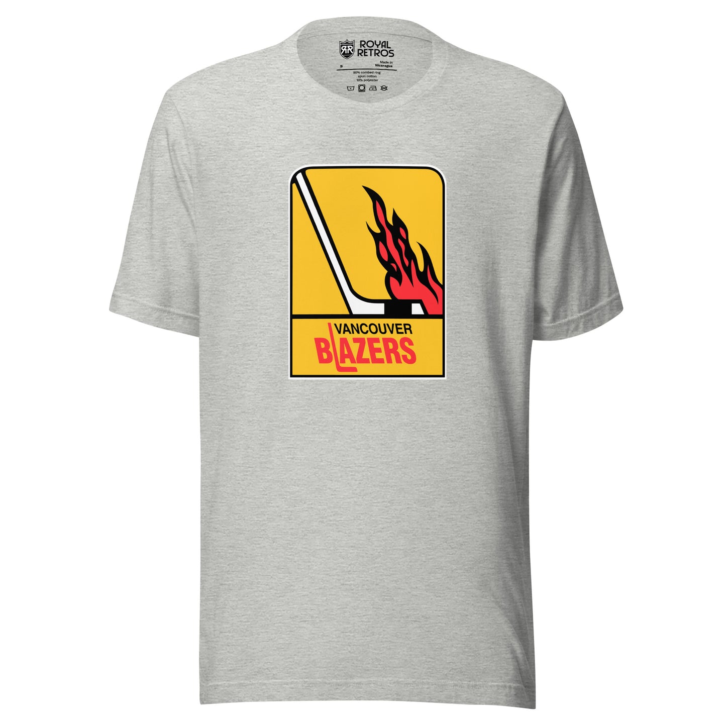 Vancouver WHA T-shirt. Light gray. Logo is vertical gold rectangle. Hockey stick in white facing right. Flames above the blade. Vancouver in black small above Blazers larger in red. L is a hockey stick Royal Retros