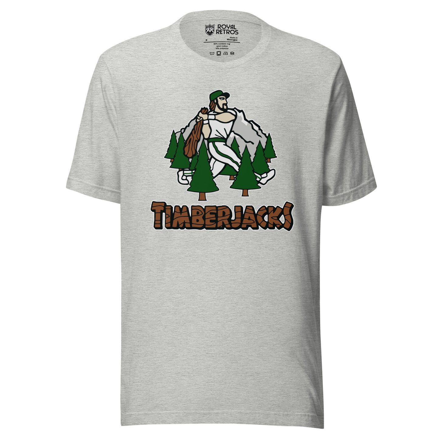 Southern Oregon Timberjacks baseball T-shirt. Gray. Mountain with lumberjack walking and swinging bat surrounded by 7 evergreen trees. Timberacks in log/timber typeface below. Royal Retros