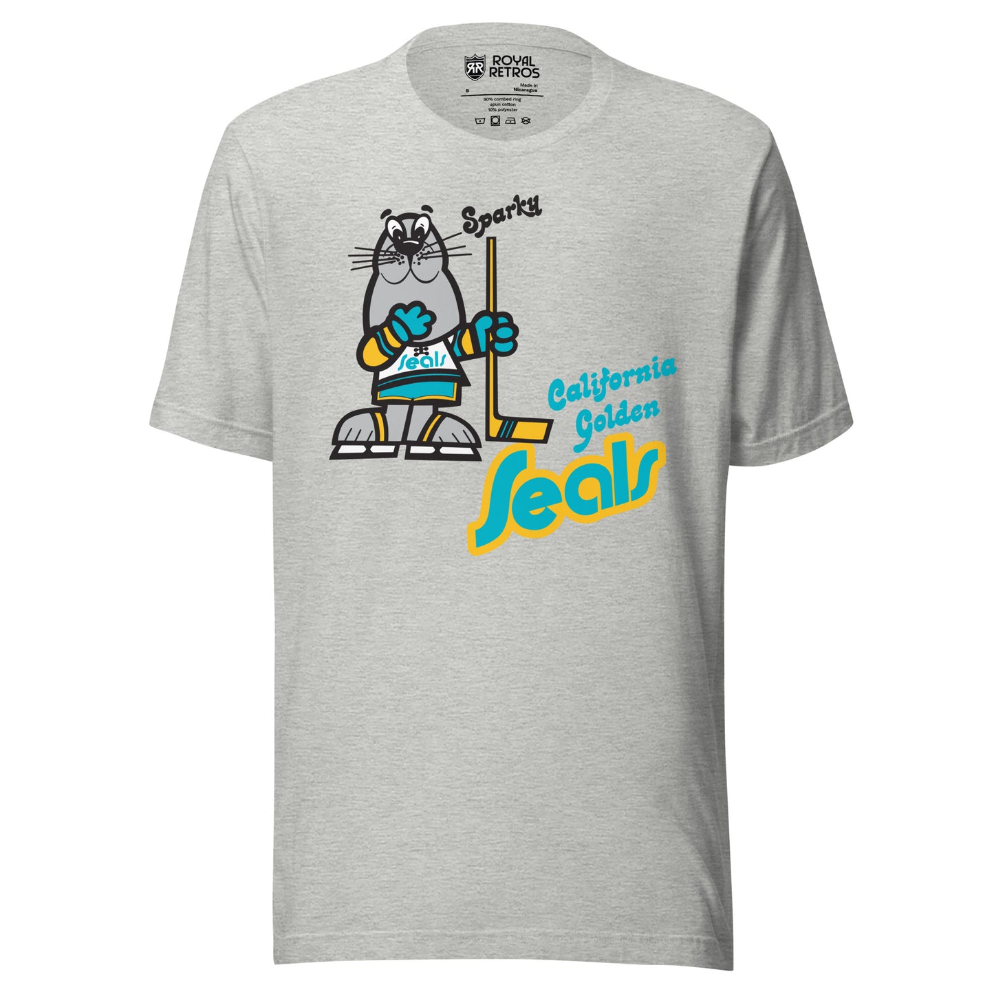 California Golden Seals Sparky T-shirt. Gray. Gray seal on skates with gold and teal gloves holding a yellow stick. California Golden in teal small to the right of hockey stick blade. Seals below in teal with gold trim lowercase in diablo typeface. Royal Retros