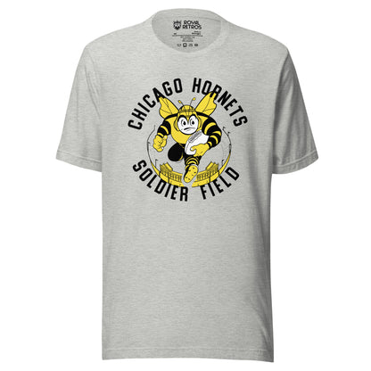 Chicago Hornets AAFC T-shirt. Gray. CHICAGO HORNETS arched in black over cartoon angry hornet rushing toward viewer with football, on top of yellow and black stadium. SOLDIER FIELD in black arched below. Royal Retros
