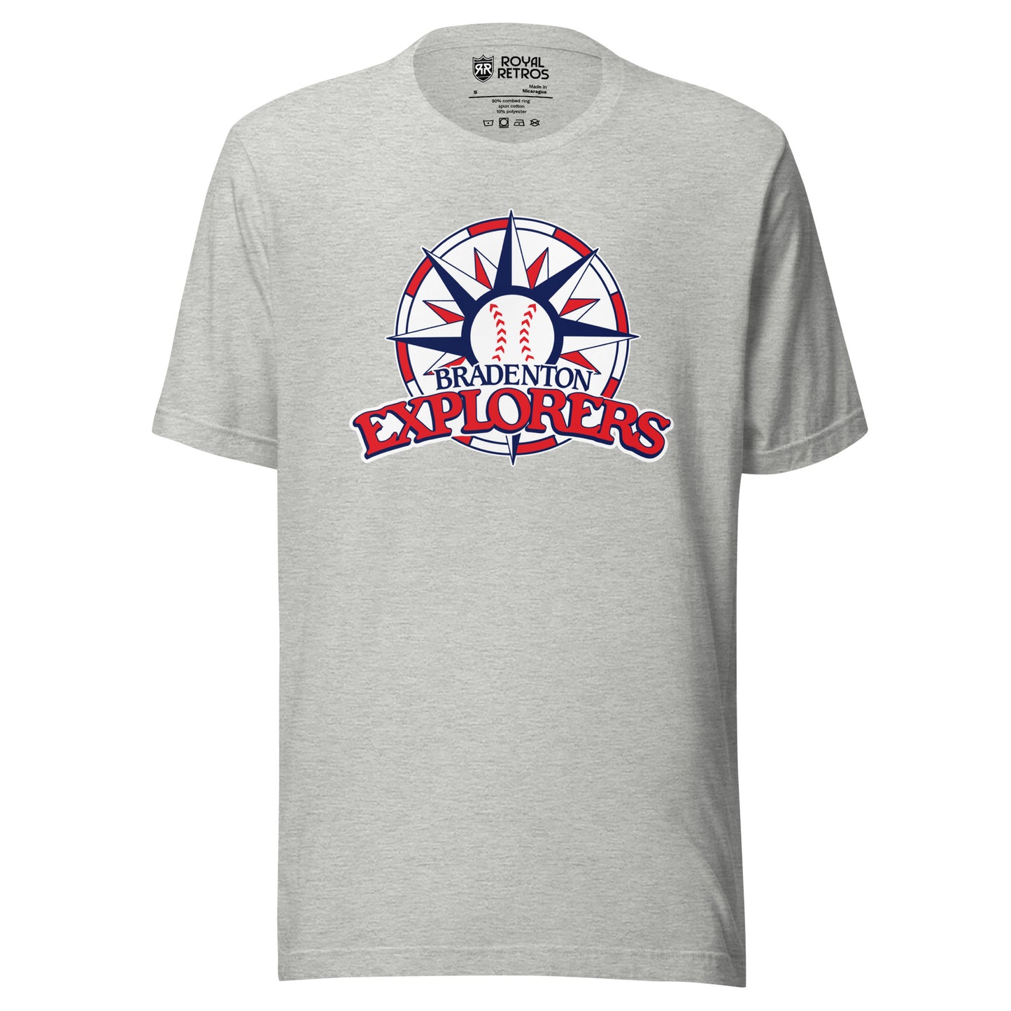 Bradenton Explorers baseball T-shirt. Gray. Circle with alternating red and white blocks. Compass star inside with alternating red and blue pattern, baseball in center. BRADENTON small in blue above EXLORERS in red across bottom of circle. Royal Retros