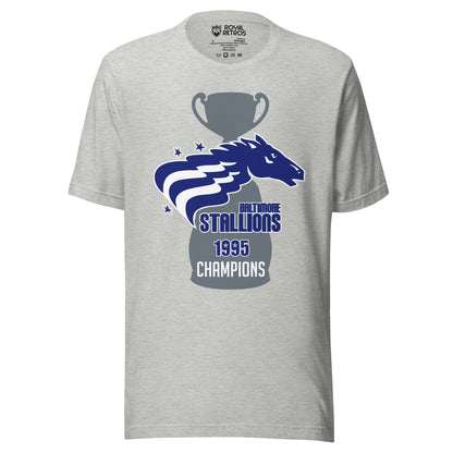 Baltimore Stallions Championship T-short. Gray. Large gray trophy with large base. Over top is a horses head in blue facing right. Two white wavy stripes from its mane. Two blue stars upper left, one lower left. Baltimore below right in blue. Stallions in blue big below. 1995 below in blue. Champions in white below that. Royal Retros