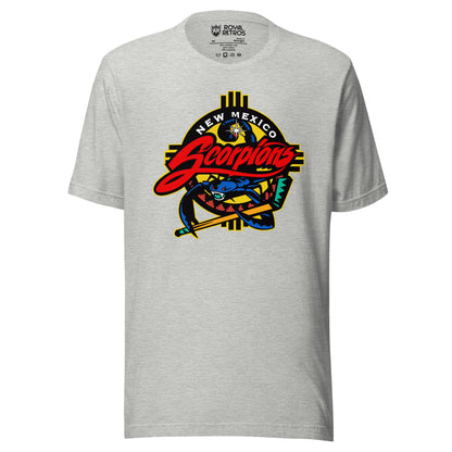 New Mexico Scorpions hockey T-shirt in athletic heather gray. Southwestern Zia-sun emblem in yellow and black behind a blue scorpion gripping a hockey stick, with 'New Mexico Scorpions' wordmark in white and red script.