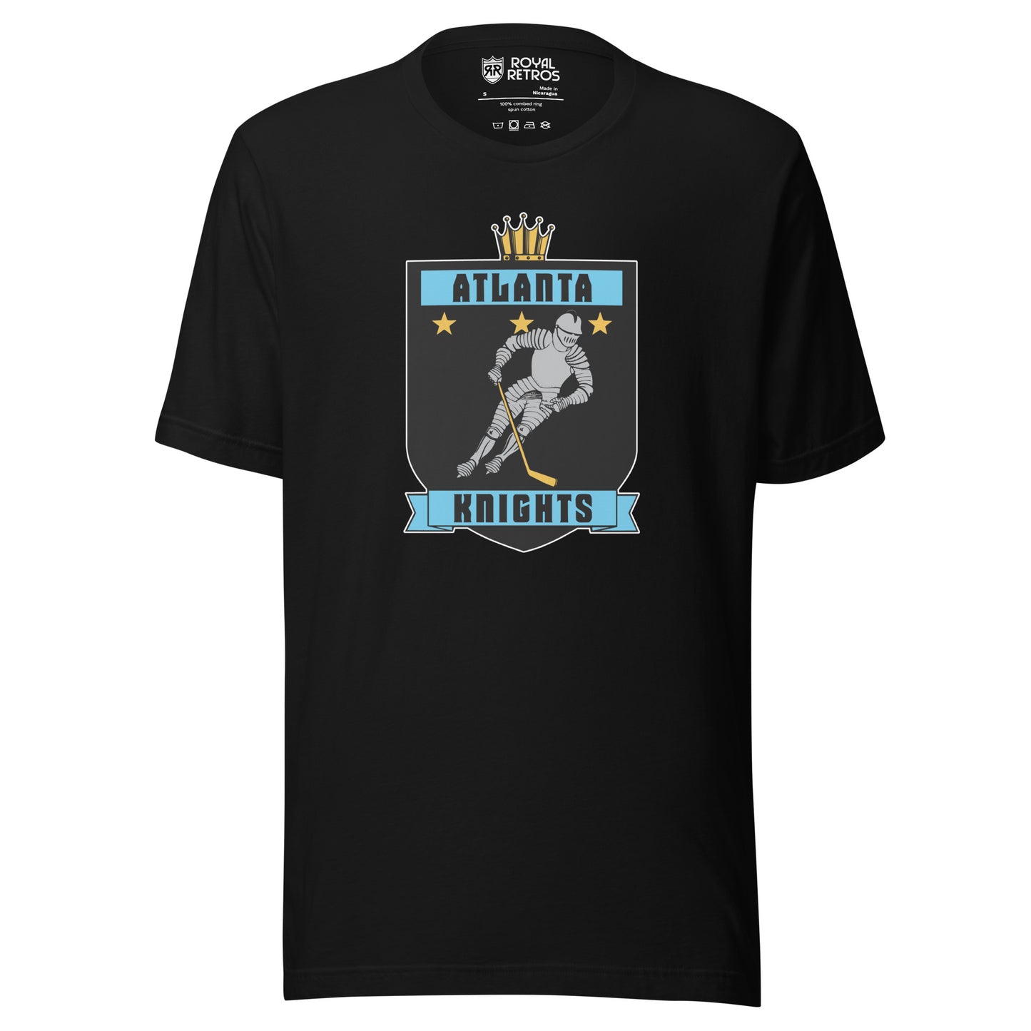 Atlanta Knights hockey T-shirt. Black. Black shield with small gold crown on top. Blue band inside top with ATLANTA in black. 3 gold stars below that. Knight with hockey stick skating leaning right. Blue banner with Knights below bottom if shield. Royal Retros. 