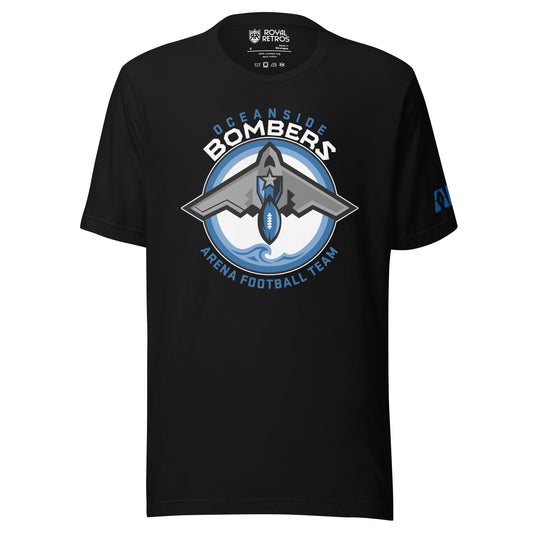 Oceanside Bombers football T-shirt. Black. Oceanside in blue arched above Bombers slightly larger in white over a circle outlined in white and two slightly larger rings, blue and light blue inside. White background. B-2 bomber from the top over the circle with wings slightly protruding. A football coming off the tail. An ocean wave appears in the bottom of the circle. Outside the circle arched below is Arena Football team arched up in blue. Royal Retros