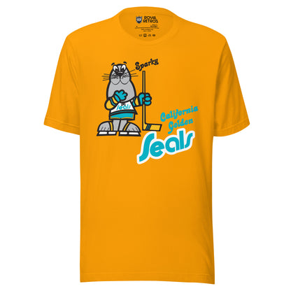 California Golden Seals Sparky T-shirt. Gold. Gray seal on skates with gold and teal gloves holding a yellow stick. California Golden in teal small to the right of hockey stick blade. Seals below in teal with gold trim lowercase in diablo typeface. Royal Retros