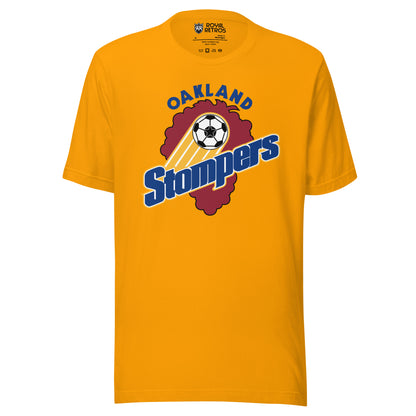 Gold t-shirt with an Oakland Stompers graphic: a gold-trailed soccer ball above bold blue 'Stompers' script