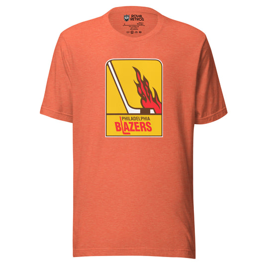 Philadelphia Blazers WHA T-shirt. Light Orange. Logo is vertical gold rectangle. Hockey stick in white facing right. Flames above the blade. Philadelphia in black small above Blazers larger in red. L is a hockey stick Royal Retros