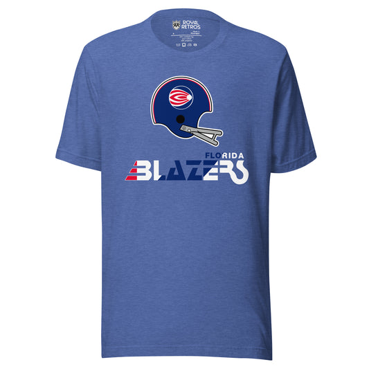 Florida Blazers World Football league WFL T-shirt. Blue. Logo is a blue helmet with gray face guard with a circular logo featuring  red and white swoops going away from a small circle inside right. Florida small to the right stylized Blazers large below in red, white, and blue. Royal Retros.