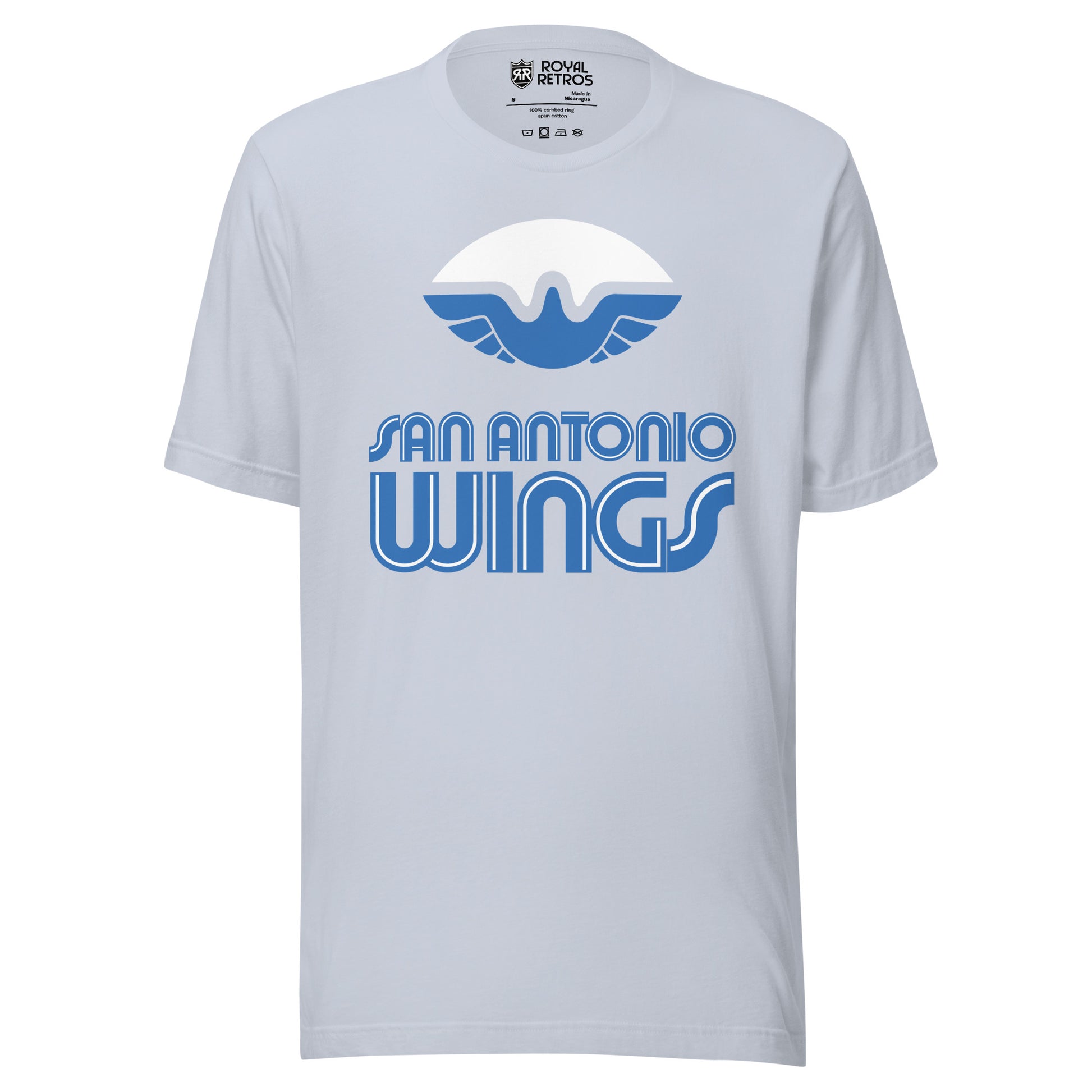 San Antonio Wings World Football League WFL T-shirt. Light Blue. White football with stylized bird with wings in blue filling in the bottom of the ball. San Antonio in blue with white trim above larger WINGS. Royal Retros