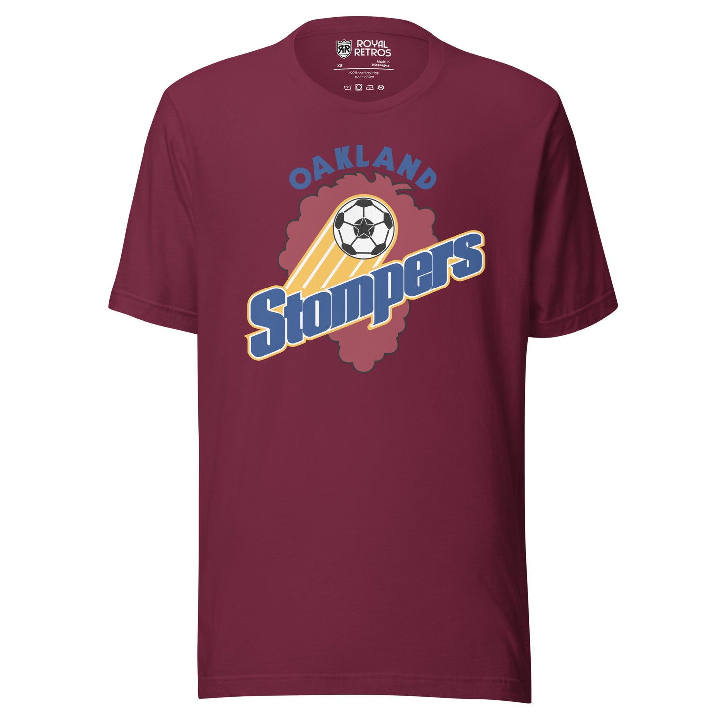 Maroon t-shirt with an Oakland Stompers graphic: a gold-trailed soccer ball above bold blue 'Stompers' script