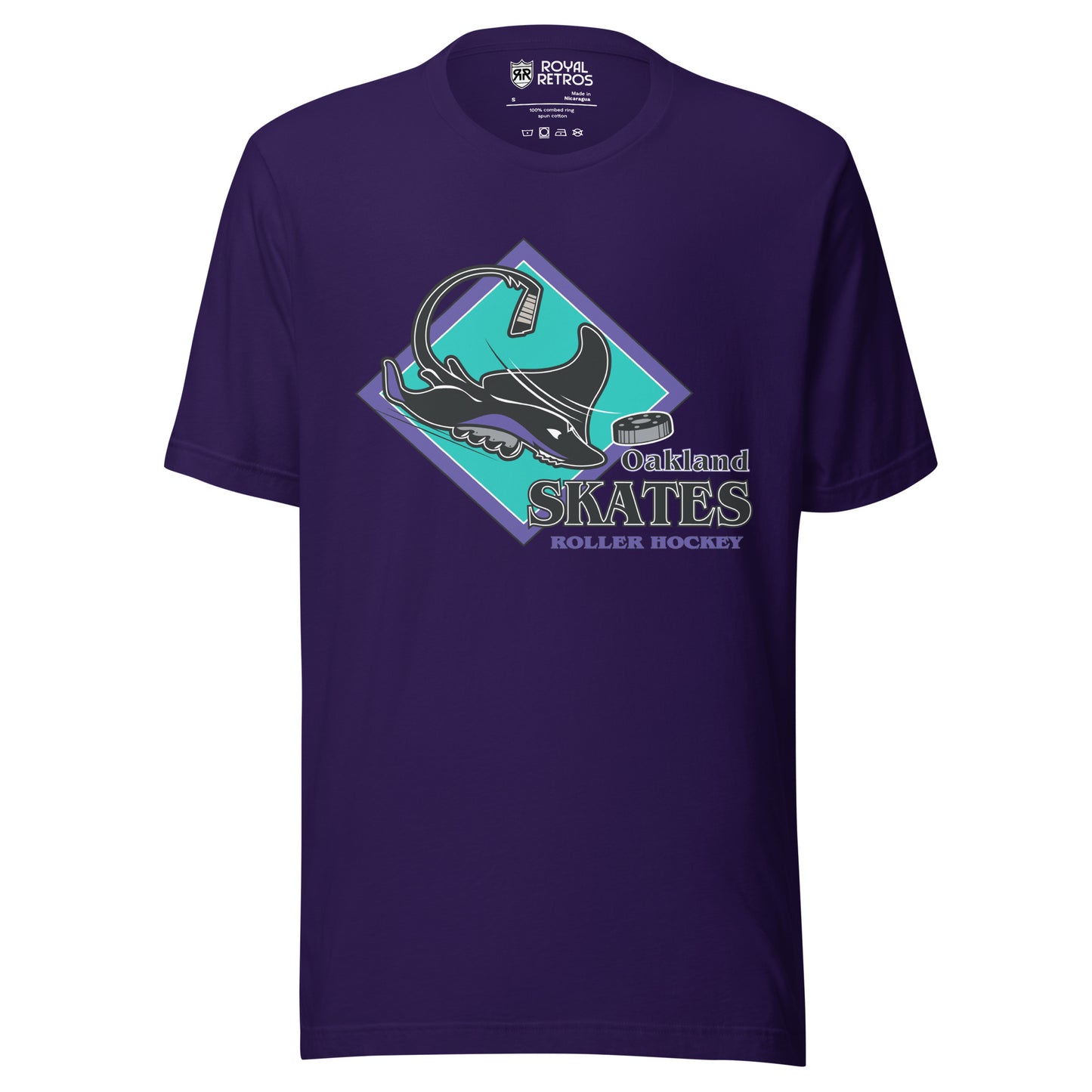 Oakland Skates roller hockey T-Shirt. Purple. Aqua diamond with purple trim. Manta Ray swimming tom the right over diamond. To the right, Oakland small over Skates large, purple with white lining, Roller Hockey smaller in purple. Royal Retros