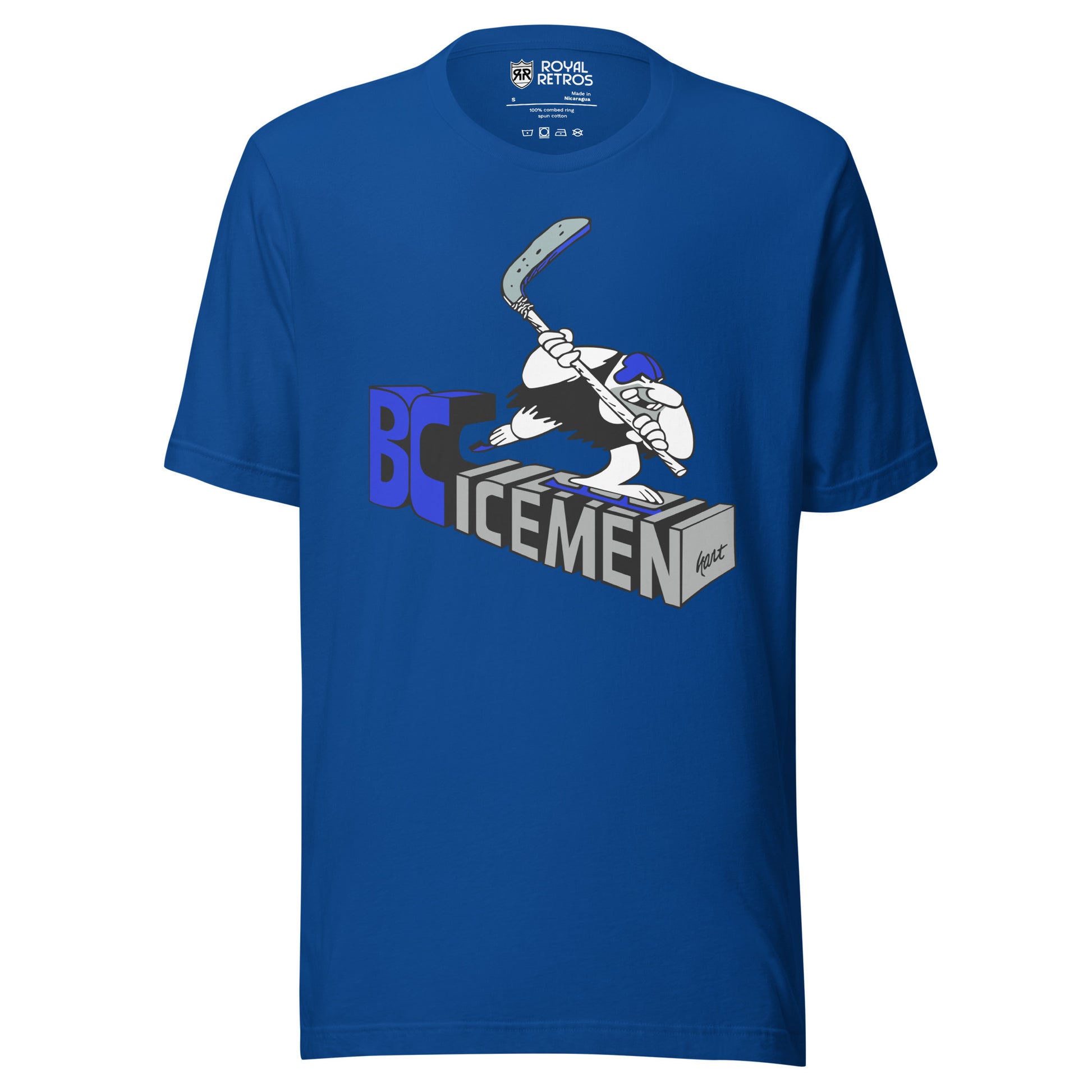 True Royal BC Icemen t-shirt with a cartoon hockey player mid-slapshot skating over 3D block letters reading BC Icemen in blue and gray