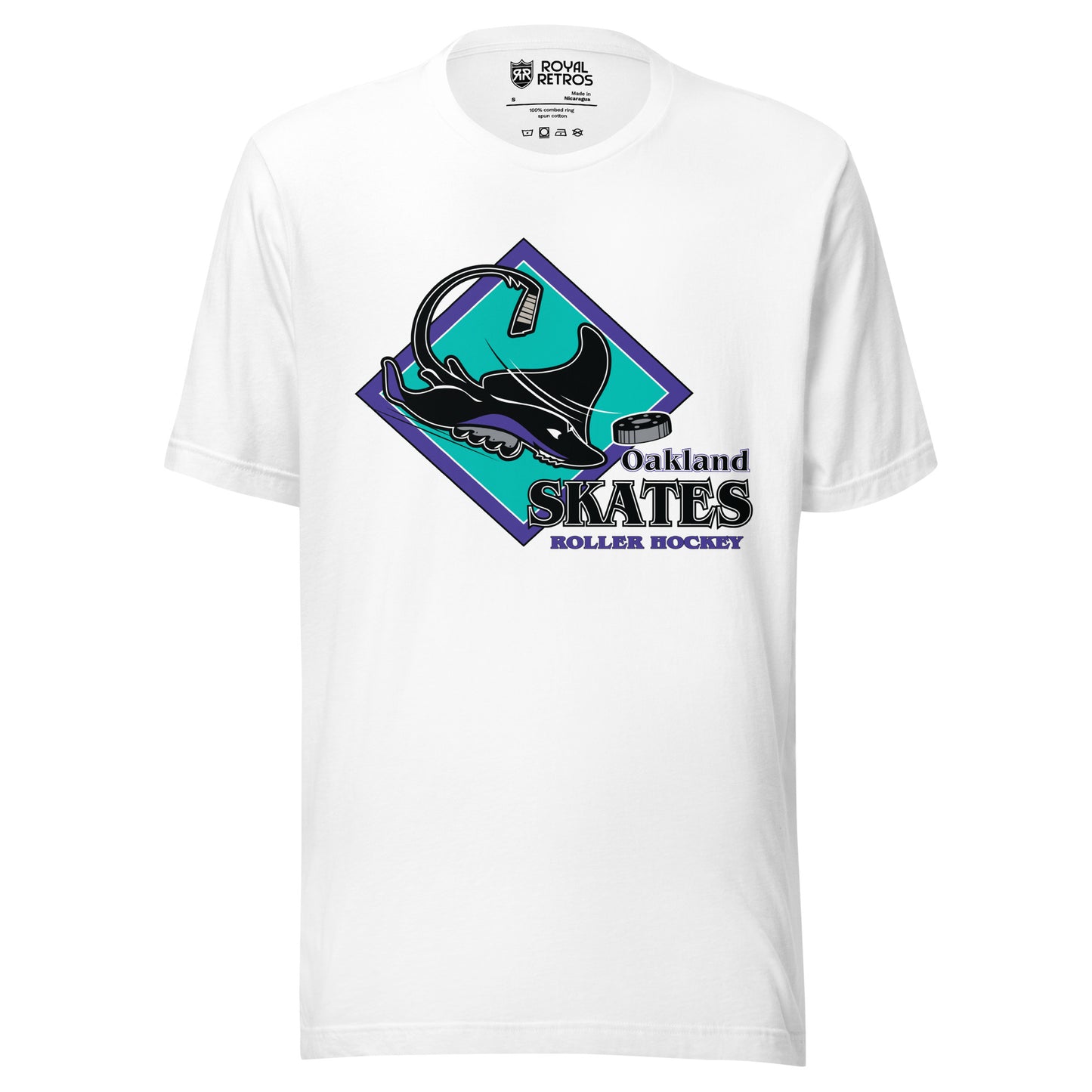 Oakland Skates roller hockey T-Shirt. White. Aqua diamond with purple trim. Manta Ray swimming tom the right over diamond. To the right, Oakland small over Skates large, purple with white lining, Roller Hockey smaller in purple. Royal Retros