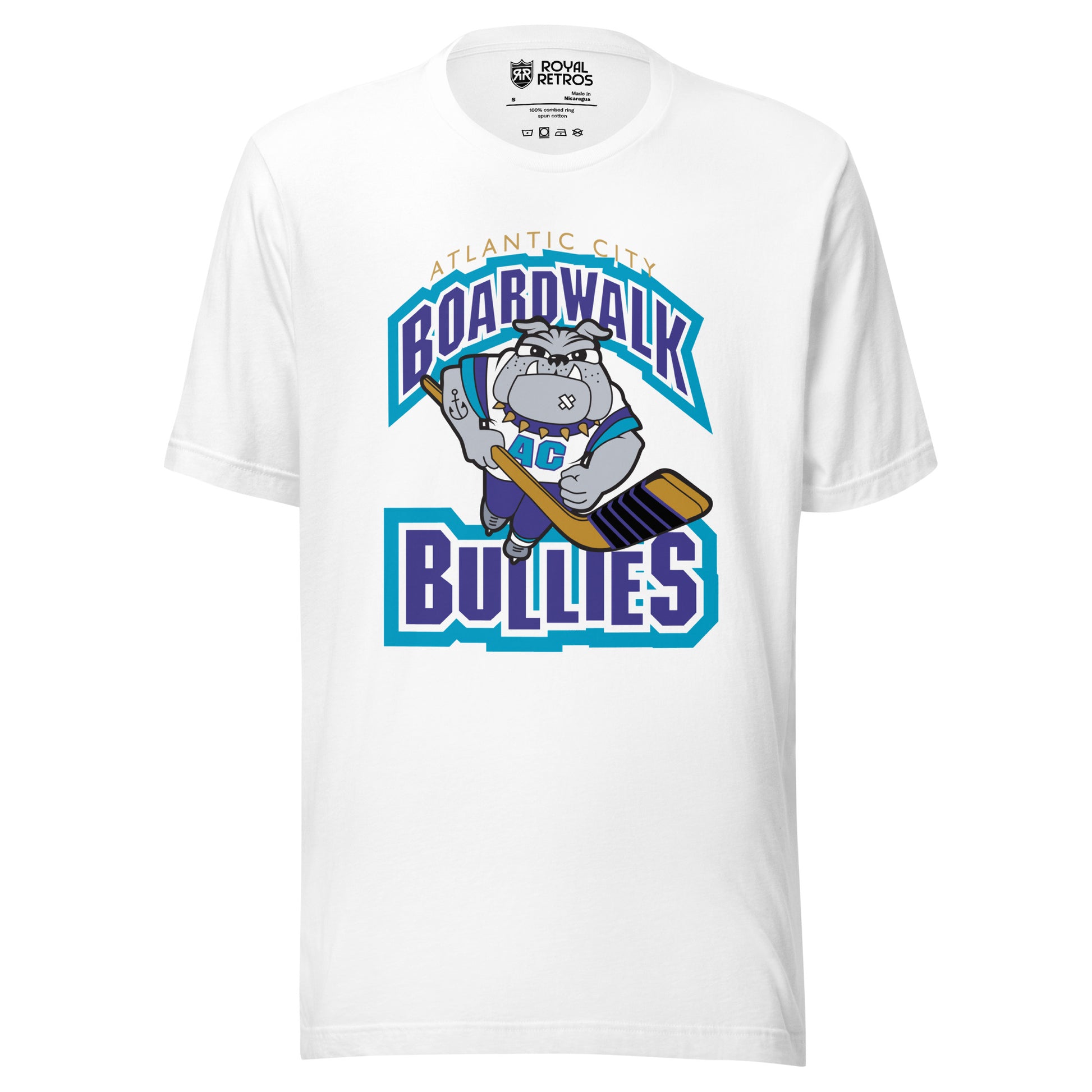 Atlantic City Boardwalk Bullies hockey T-shirt. White. Boardwalk arched in purple with white and teal trim. Cartoon bulldog skating toward viewer holding hockey stick. Bullies in purple with white and teal trim. Royal Retros
