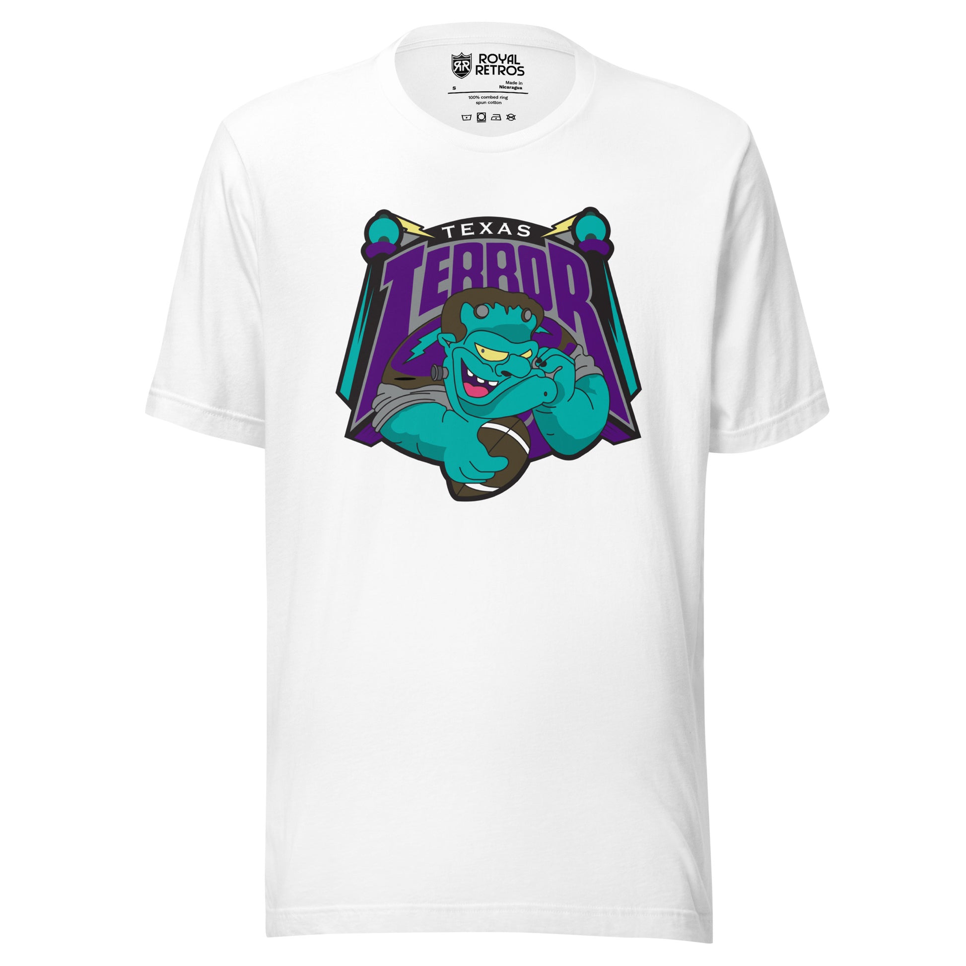 Texas Terror Arena Football League T-shirt. White. Texas small in white above purple, large Terror, with T and R extending down. Terror is above a cartoon Frankenstein from the shoulders up, open-mouth grin and holding a football in his right hand. Orbs on sticks on either side of logo. Royal Retros
