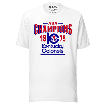Kentucky Colonels ABA 1975 Champions T-shirt. White. ABA in red with blue lines on either side. Champions in red bent in in center/ K with C coming out of it and red, white, and blue basketball inside. 19 in red to the left pf the KC and 75 to the right. Kentucky in blue below, Colonels in blue below that, blue line below that. Royal Retros