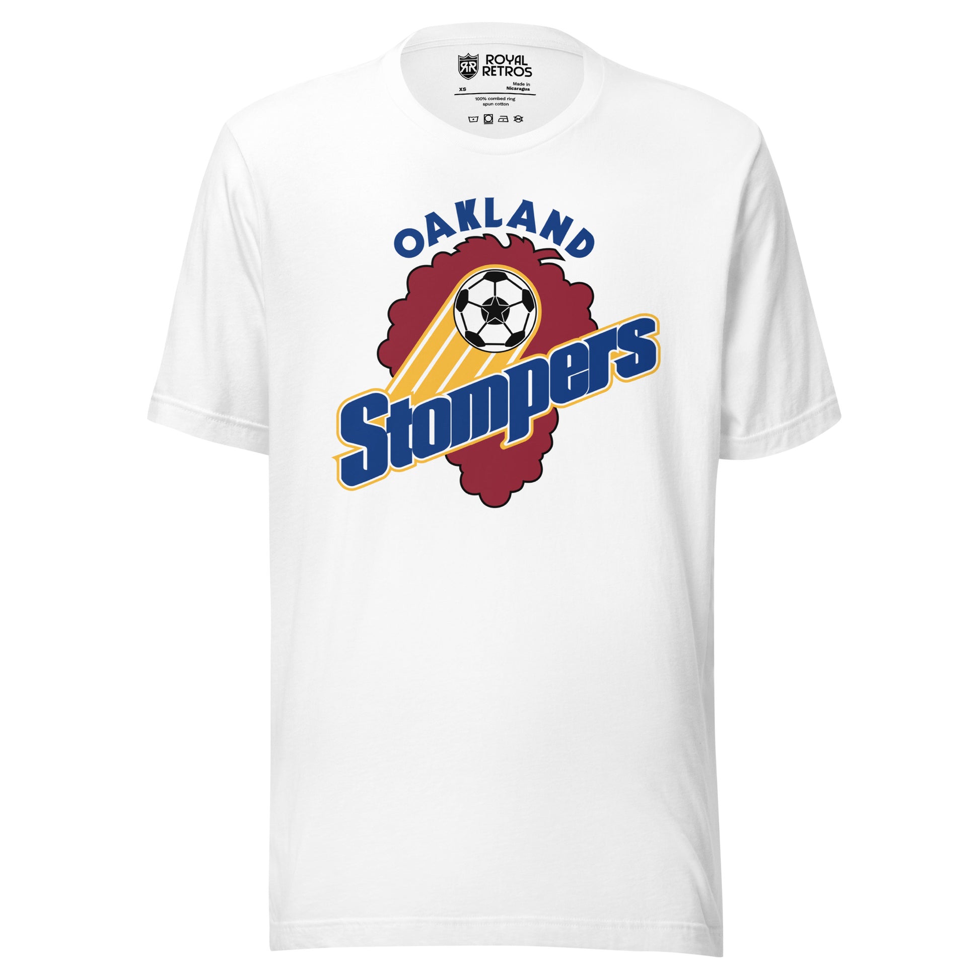 White t-shirt with an Oakland Stompers graphic: a gold-trailed soccer ball above bold blue 'Stompers' script