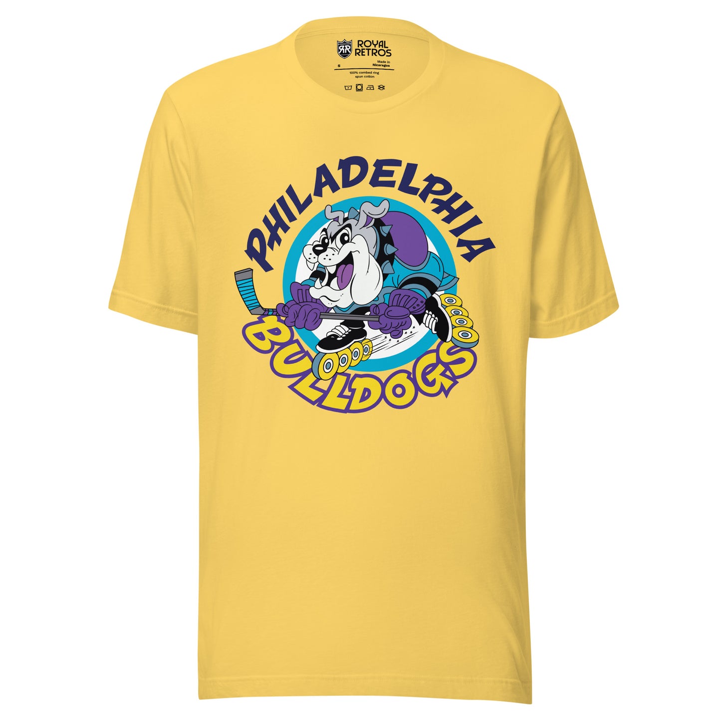 Philadelphia Bulldogs Roller Hockey -shirt. Yellow. Philadelphia in dark purple arched over cartoon bulldog inline skating with hockey stick, going to the left. Bulldogs arched up in yellow below. Royal Retros