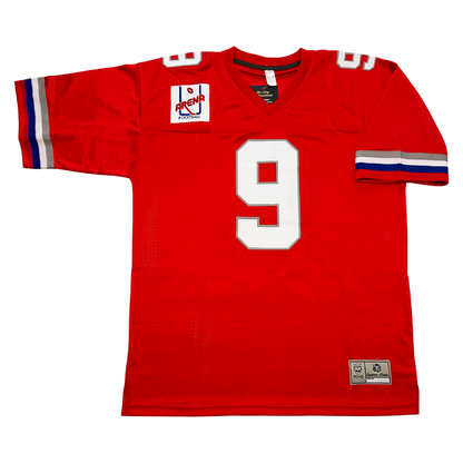 Washington Commandos AFL Jersey. Red. Silver, white, and blue bands near sleeve ends. White #9 with silver trim, large on chest, small on shoulders. Arena league logo on upper right chest, consisting of a blue goalpost. arena in red across bottom and a football above. Royal Retros