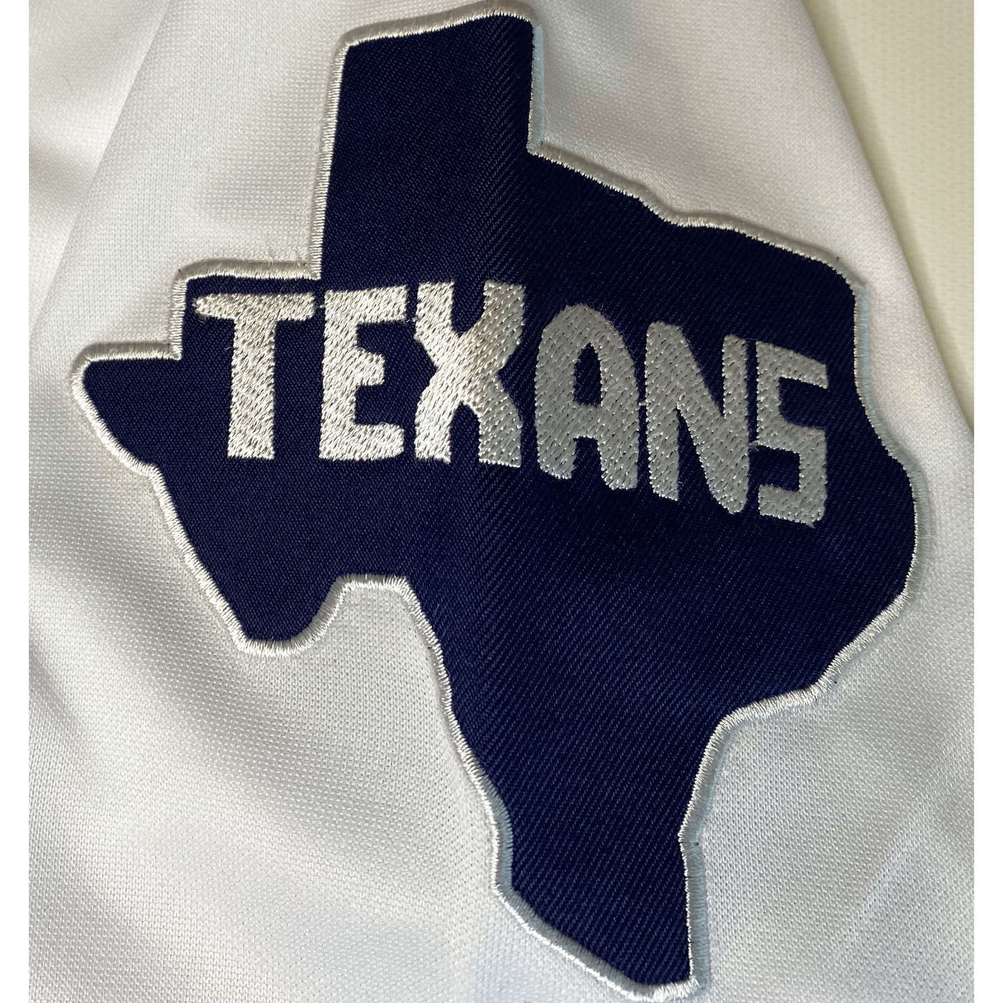 1952 NFL Dallas Texans sleeve patch. Texans in white on blue outline of Texas. Royal Retros