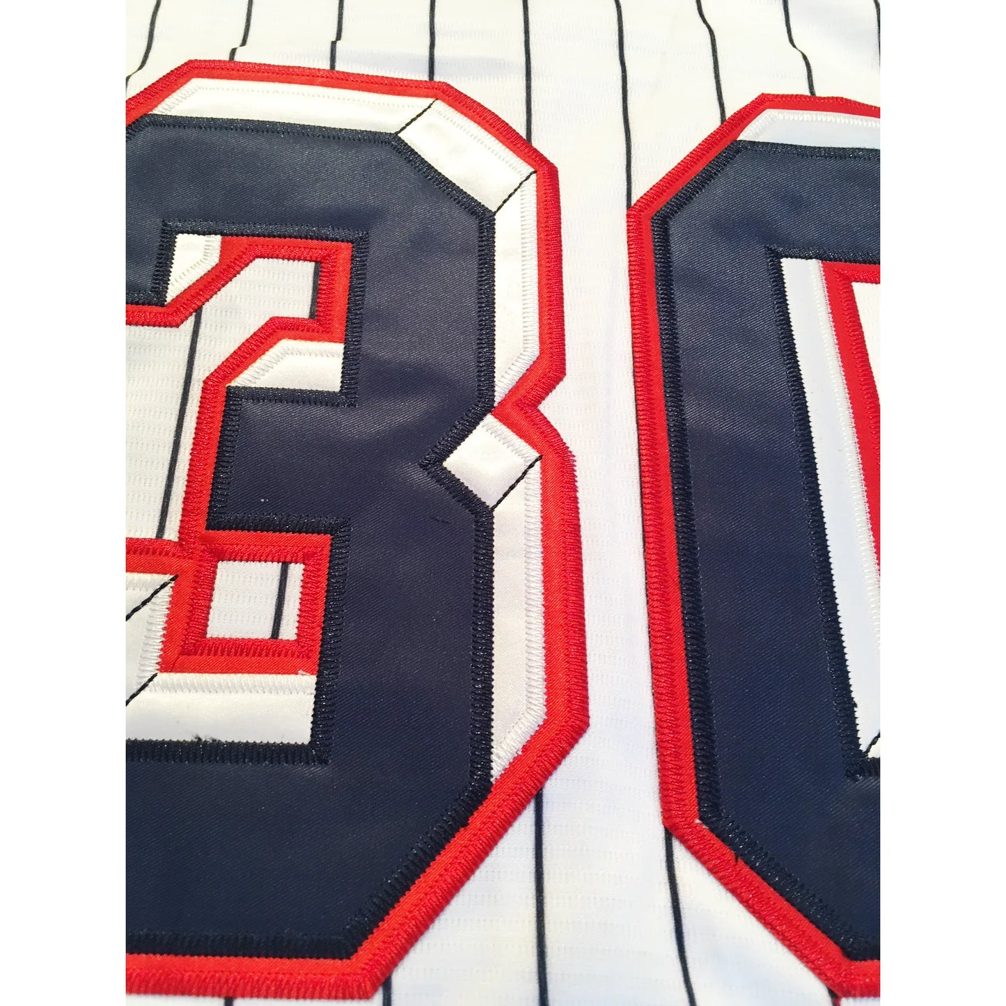 1957 Washington Senators white pinstriped jersey back close-up with blue numbers in red trim — Royal Retros