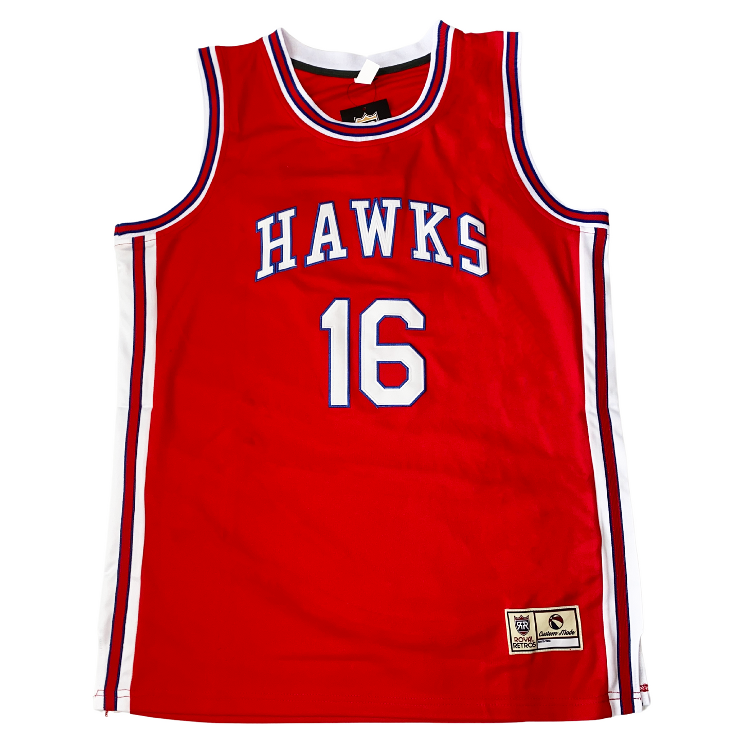 St. Louis Hawks basketball jersey. Red. Hawks in block letters, white with blue trim, arched across chest. #16 below in white with blue rim. Red, white and blue trim up sides, around shoulders and neck. Royal Retros