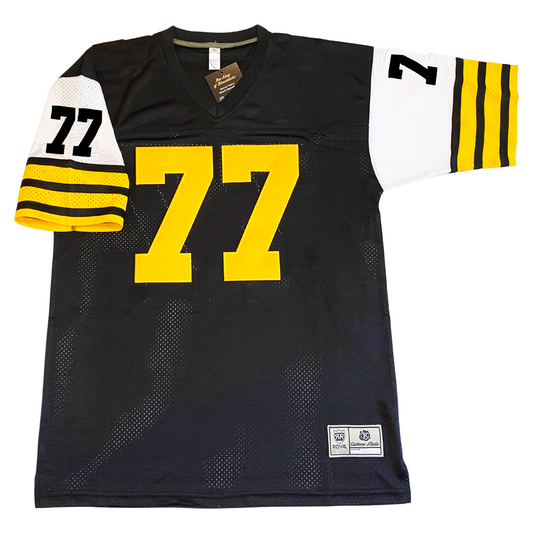 1965 Hamilton Tiger-Cats jersey black with white sleeves with yellow and black stripes. Black #77 on sleeves, yellow large  #77 on chest, black #77 small on upper sleeves Royal Retros