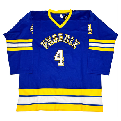 WHL Phoenix Roadrunners Jersey. Royal blue with gold V-neck collar. Front. 'PHOENIX' arched in white outlined gold across the chest above a white #4, gold-white-blue striped bands at the sleeve cuffs and waist hem.
