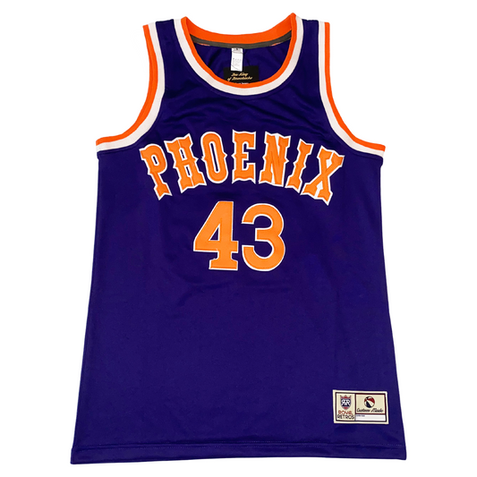 1980 phoenix suns jersey. Blue. PHOENIX in orange El Grosa West font with white trim arched across chest. #43 below orange with white tri,. Orange and white trim at shoulders and around neck. Royal Retros