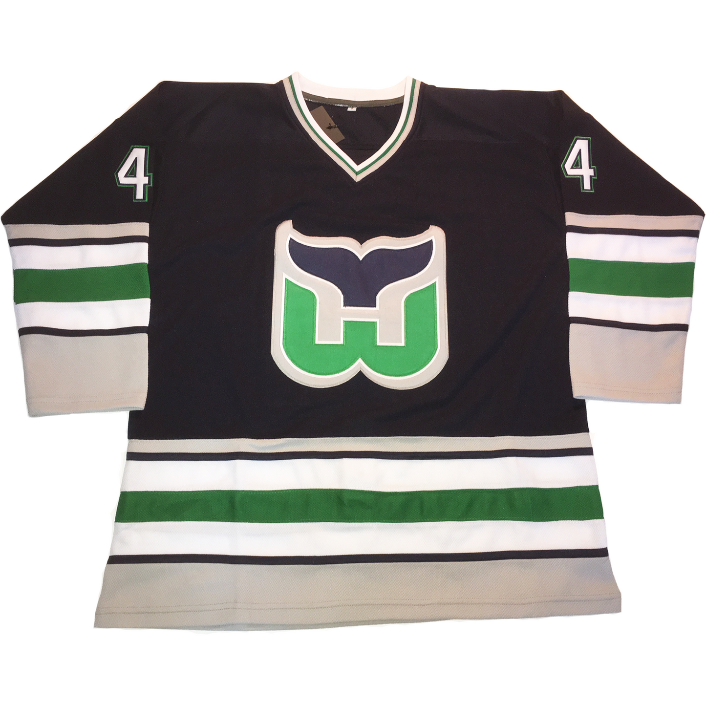 Whalers 90s Jersey navy, with gray, green, white, and black trim on sleeves and waist. W whale tail logo with blue tail and green W #4 in sliver with green trim on shoulders. Royal Retros
