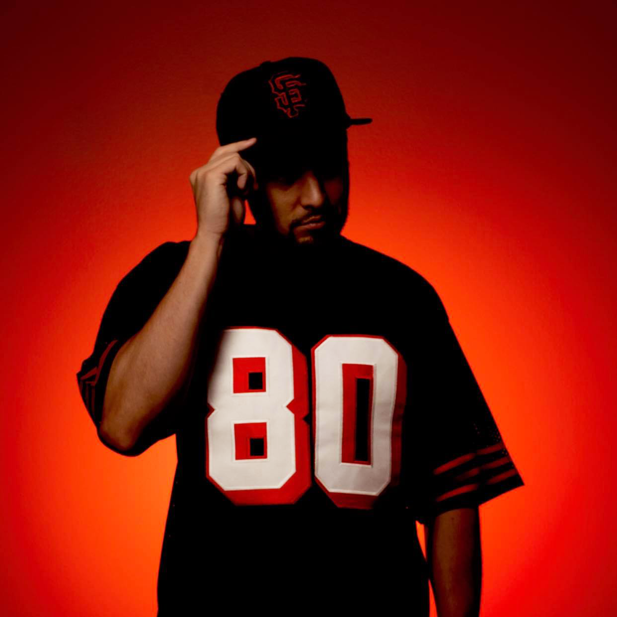 Fan wearing Faithful Jersey 1994 San Francisco Football black #80  Royal Retros