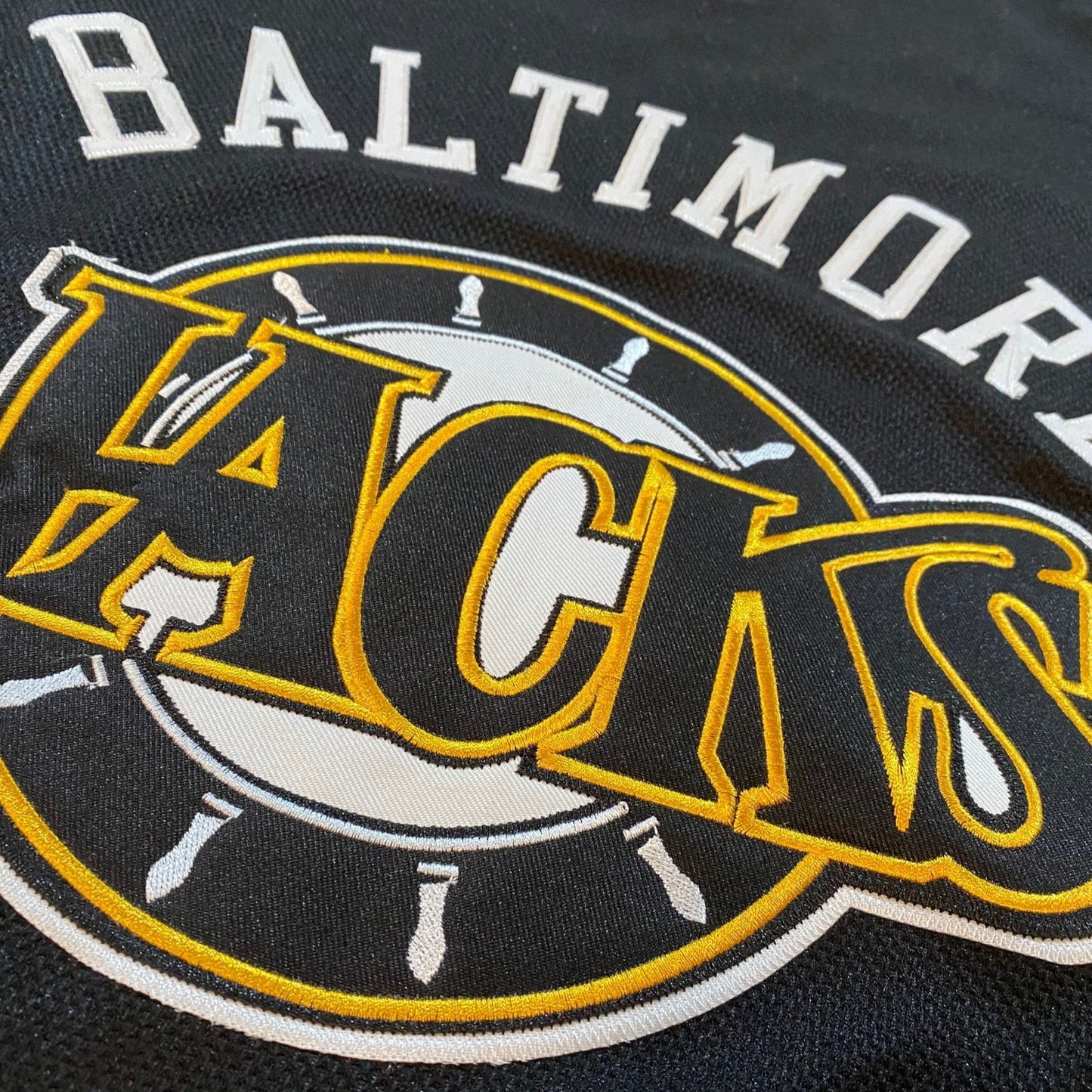 Baltimore Skipjacks close-up logo. Baltimore in white arched above Jacks logo. Royal Retros.