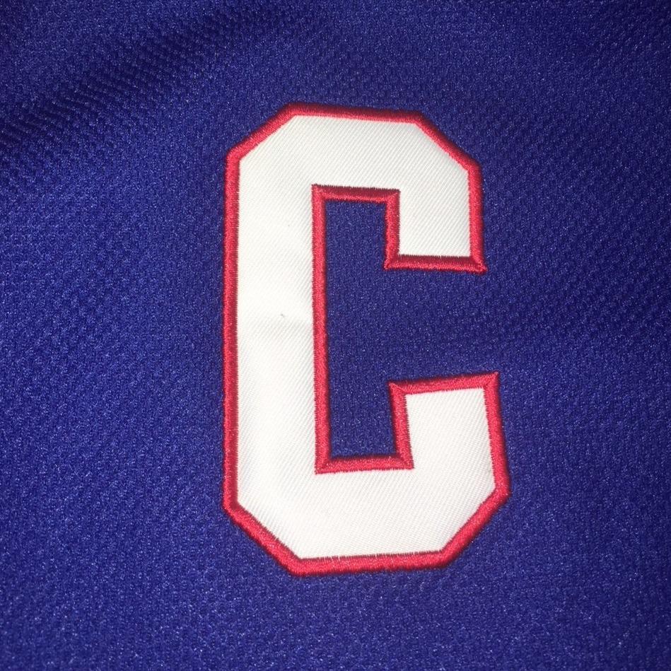 Captain Patch for hockey jersey. Embroidered white "C" with red trim on blue background. Royal Retro