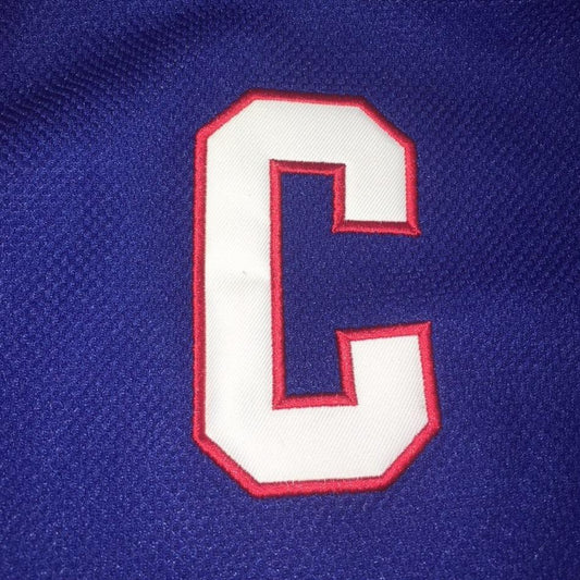Captain Patch for hockey jersey. Embroidered white "C" with red trim on blue background. Royal Retro