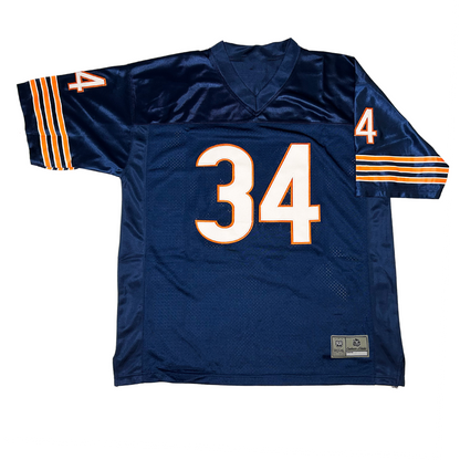 Chicago Bears jersey blue. Three white, orange, and white bands on sleeves. #34 white with orange trim, large on chest and small on sleeves. Royal Retros