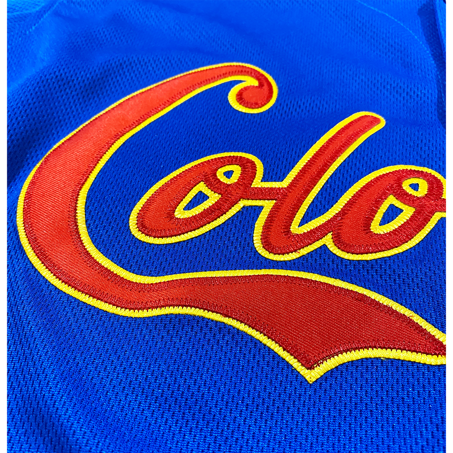 Blue fabric Colombia Baseball Jersey with embroidered red and yellow lettering