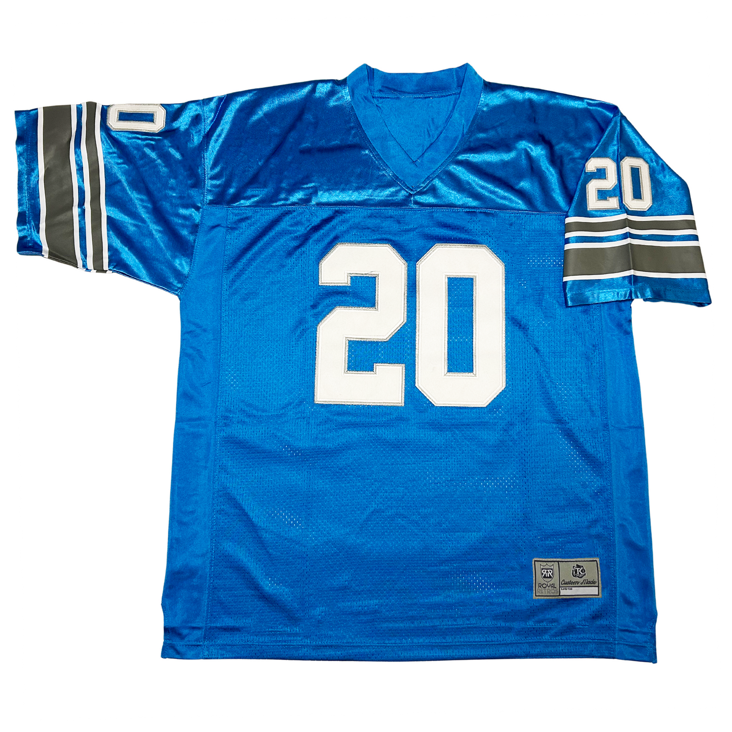 Detroit Lions jersey. Blue. Small, white, black, white bands on sleeve ends then blue, thin white, thick black, thin white then blue. Large white #20 on chest, small on sleeve. Royal Retros