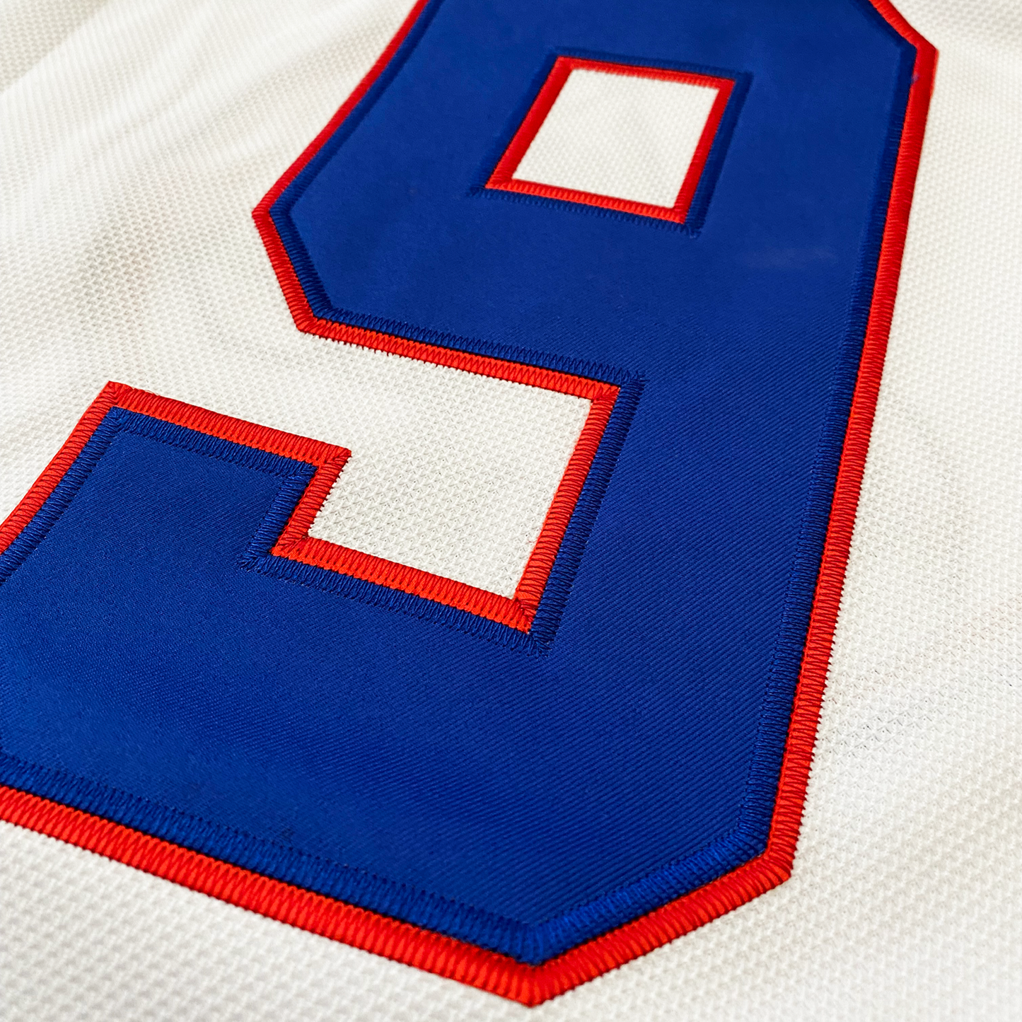 KC Scouts jersey white close-up #9 in blue with red trim on white jersey. Royal Retros