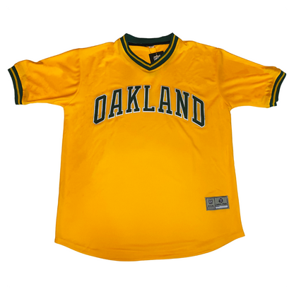 Oakland A's baseball jersey yellow with green and yellow trim on neck and sleeves. Oakland in green with white trim across chest. Royal Retros