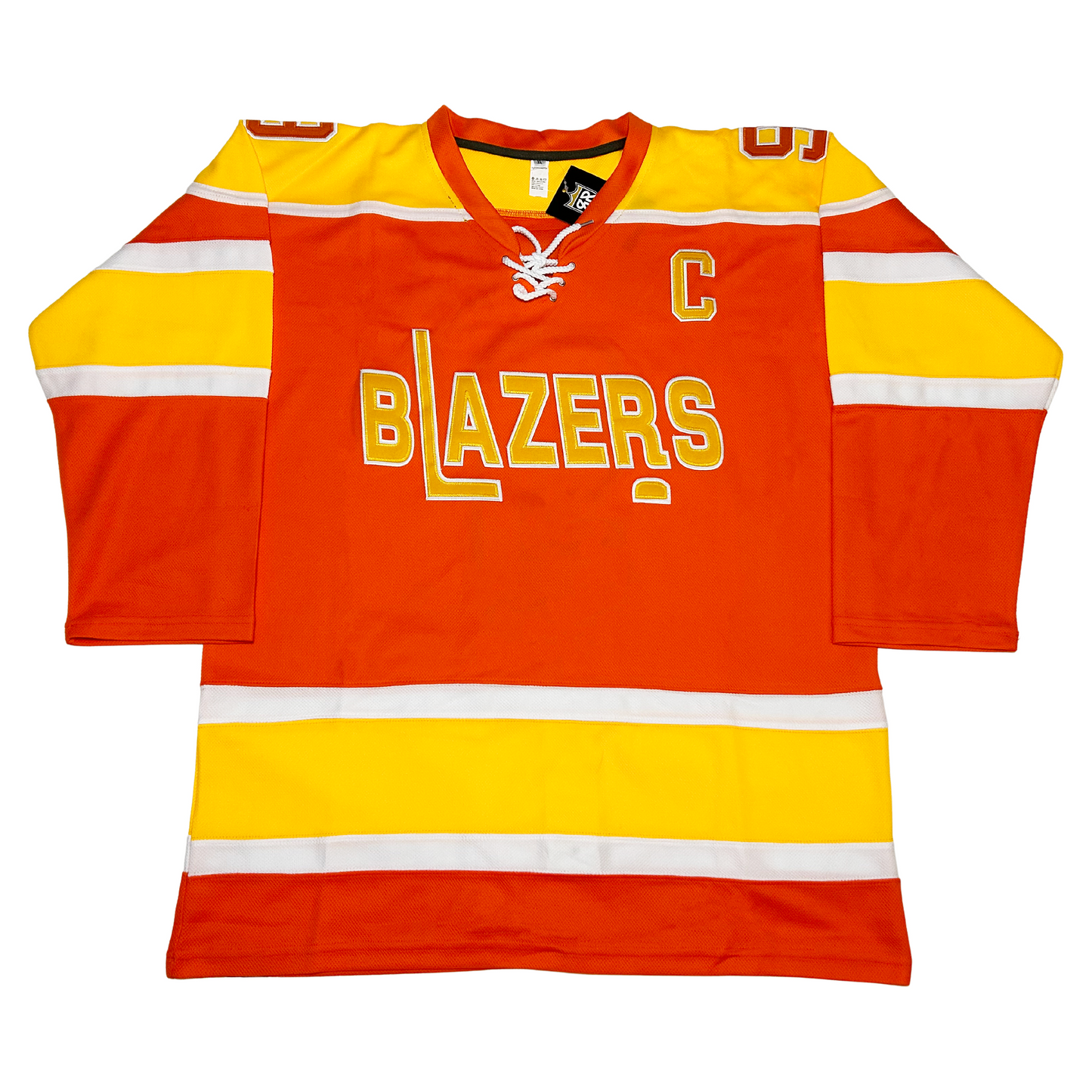 Philadelphia Blazers Jersey. Orange. Gold shoulders with white trim. White, gold, and white bands mid-sleeve and just above waist. Captains C in orange with white trim. BLAZERS in gold with white trim. L forming hockey stick. Gold puck with white trim below R.  Royal Retros
