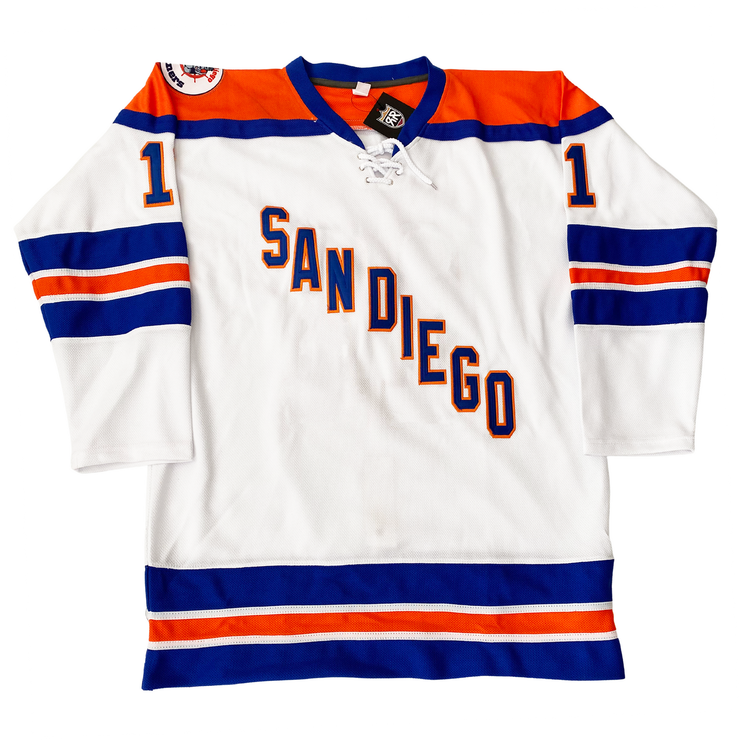 San Diego Mariners hockey jersey. White. Orange shoulders with blue trim. Blue, white, orange, wjite, and blue bands mid-sleeve and around waist. SAN DIEGO diagonal down left to right in blue with orange trim. Logo patch on right shoulder. Royal Retros