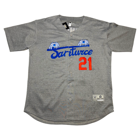 Santurce Cangrejeros button=up baseball Jersey pepper gray. Santurce in bluecursive  across chest. Blue bat across top with blue crabs with white detail on either end.  #21 in red to the bottom right. Royal Retros
